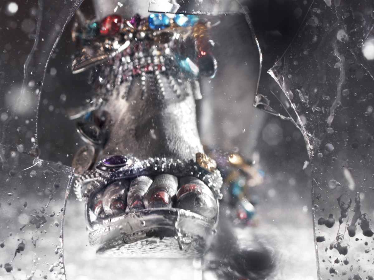 Artwork by Marilyn Minter of a foot wearing a silver, bangled shoe.