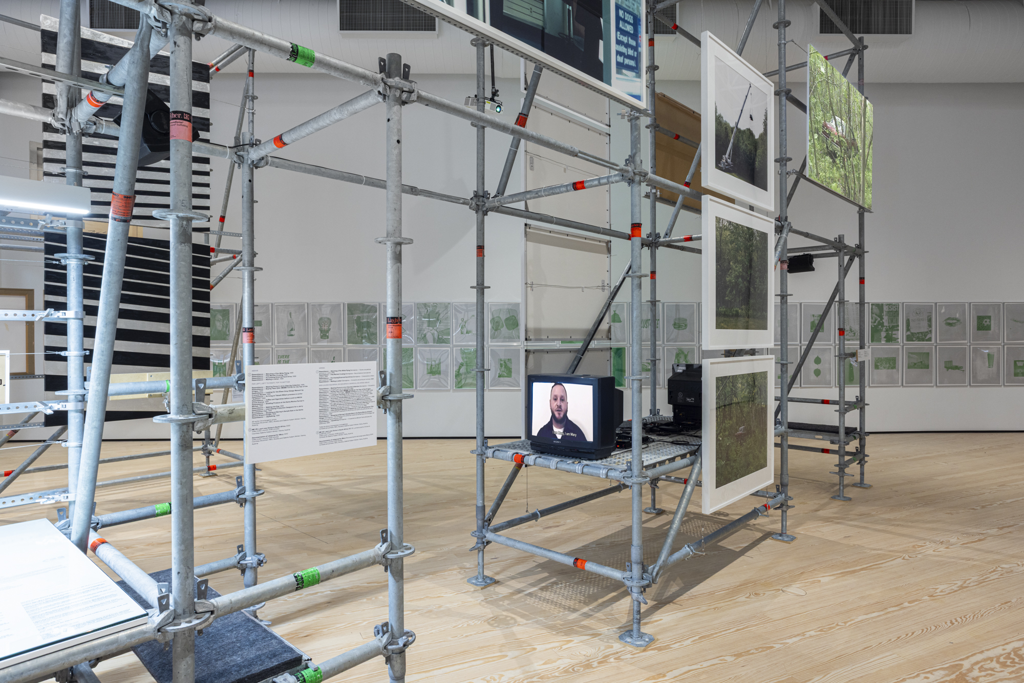 Installation view with a television set on a scaffold