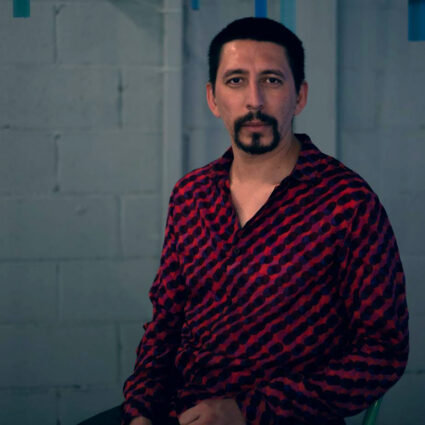 Portrait of artist and curator Edgar Picazo Merino, who founded the binational art encounter Sutura.