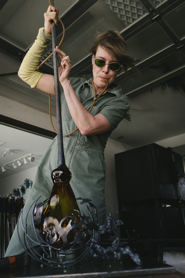 Sculptor Kate Casanova blows glass.