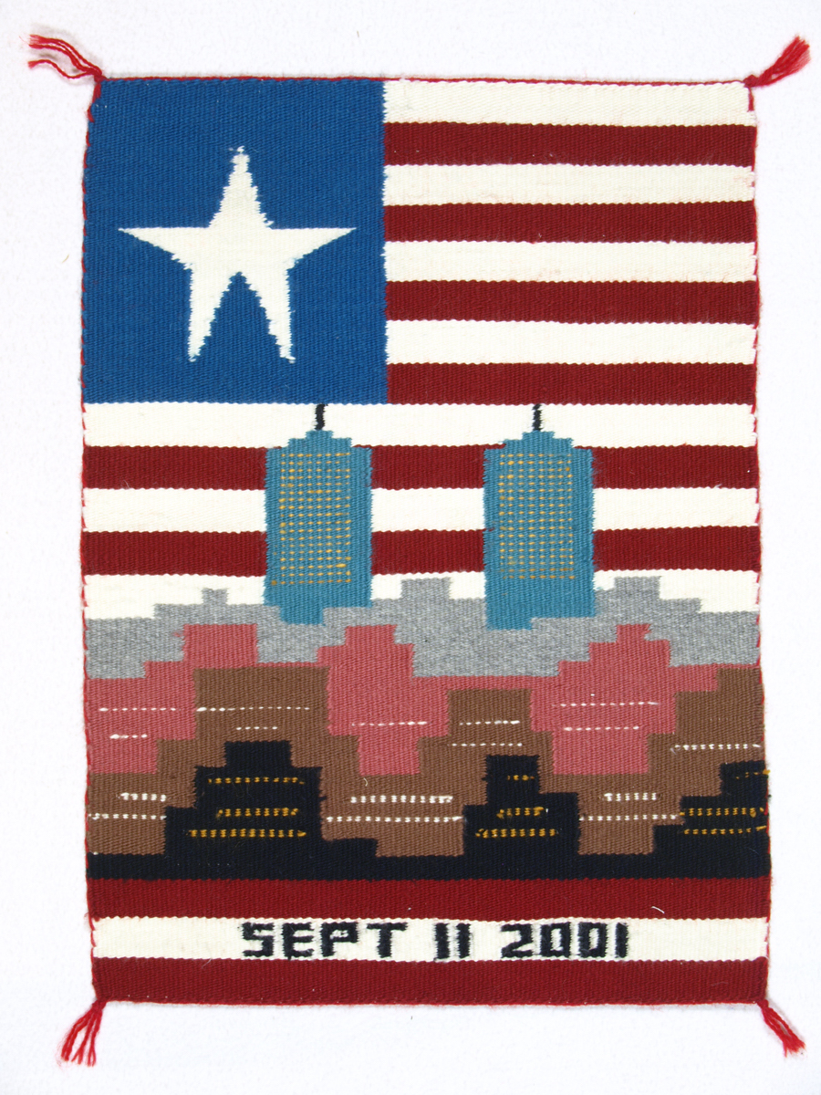Navajo weaving depicting the Twin Towers in Manhattan, with an American Flag background.