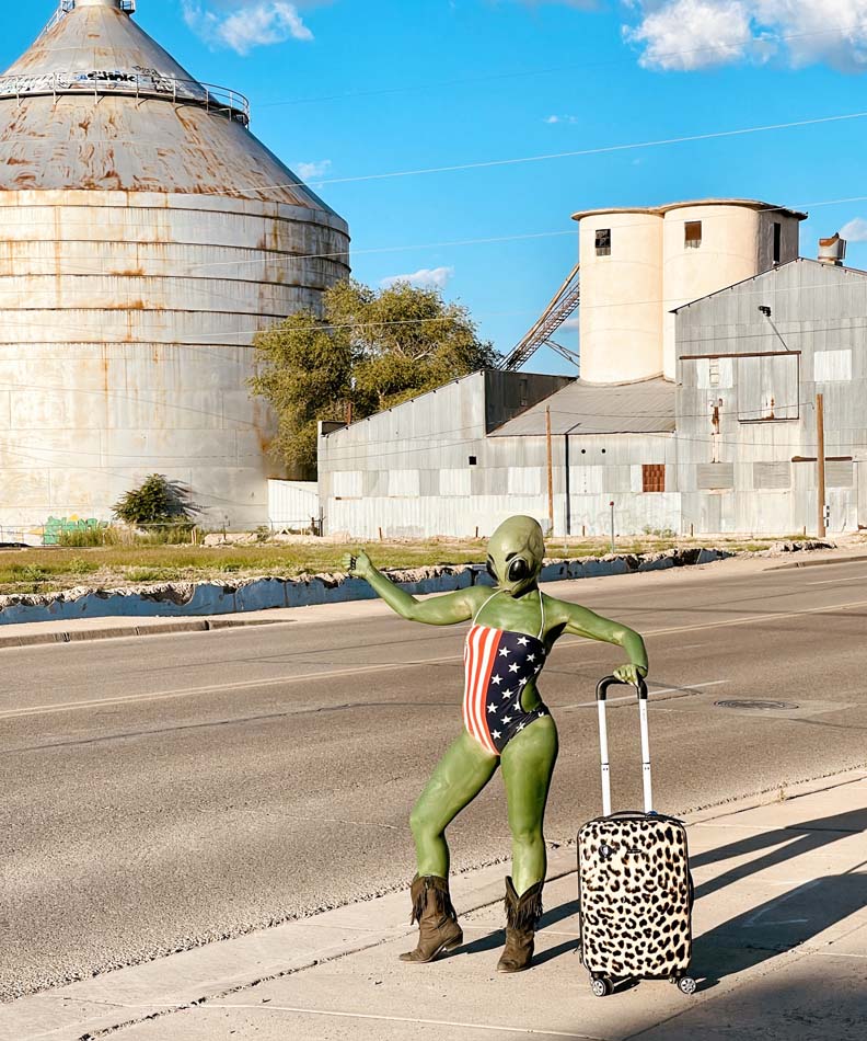 La Pocha Nostra,<i>Hitchhiking Alien</i>, Jess Fitz tries to get a ride in the streets of Roswell, New Mexico. 