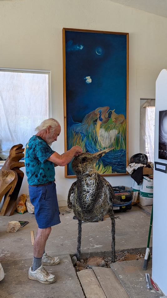 Portrait of late Utah sculptor Joe Pachak at work.