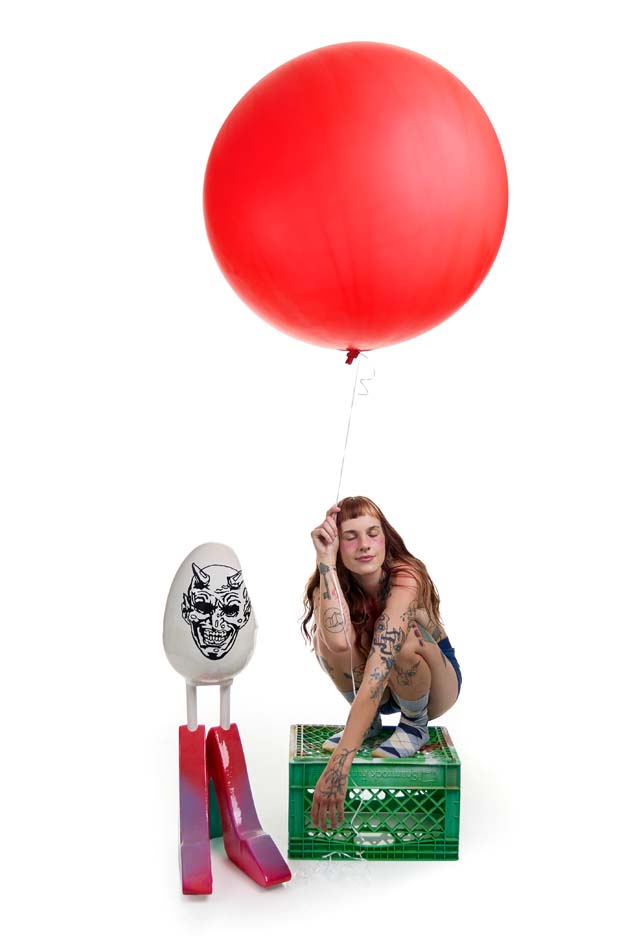 Lady Egg with her sculpture titled <i>self-portrait</i>.
