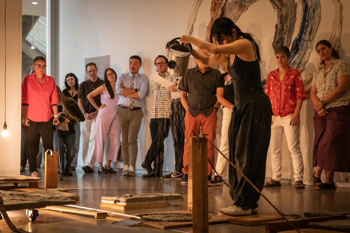 Still of a performance by Sining Zhu in the exhibition Earth's Winding Sheet in Reno.